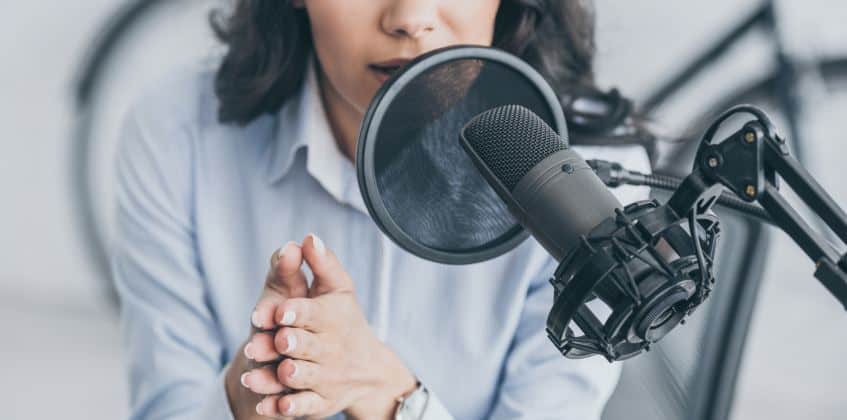 female hosting podcast