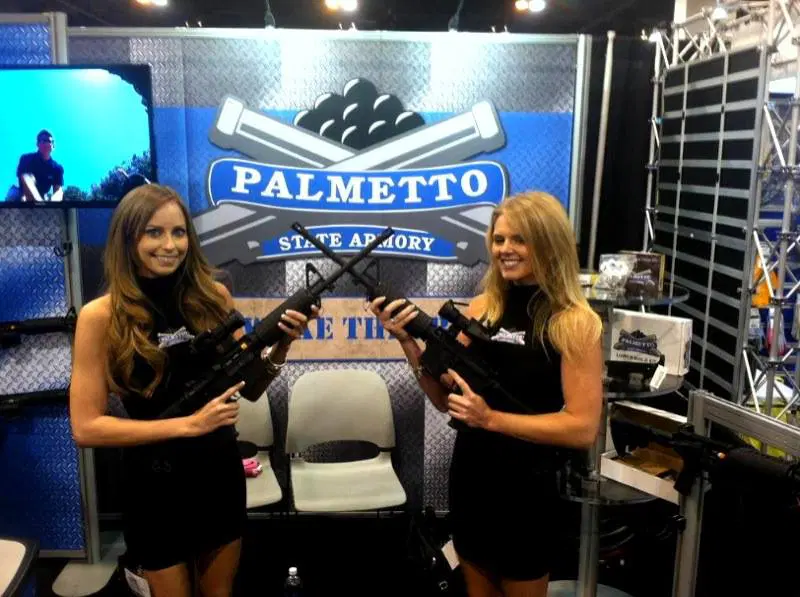two women with firearms