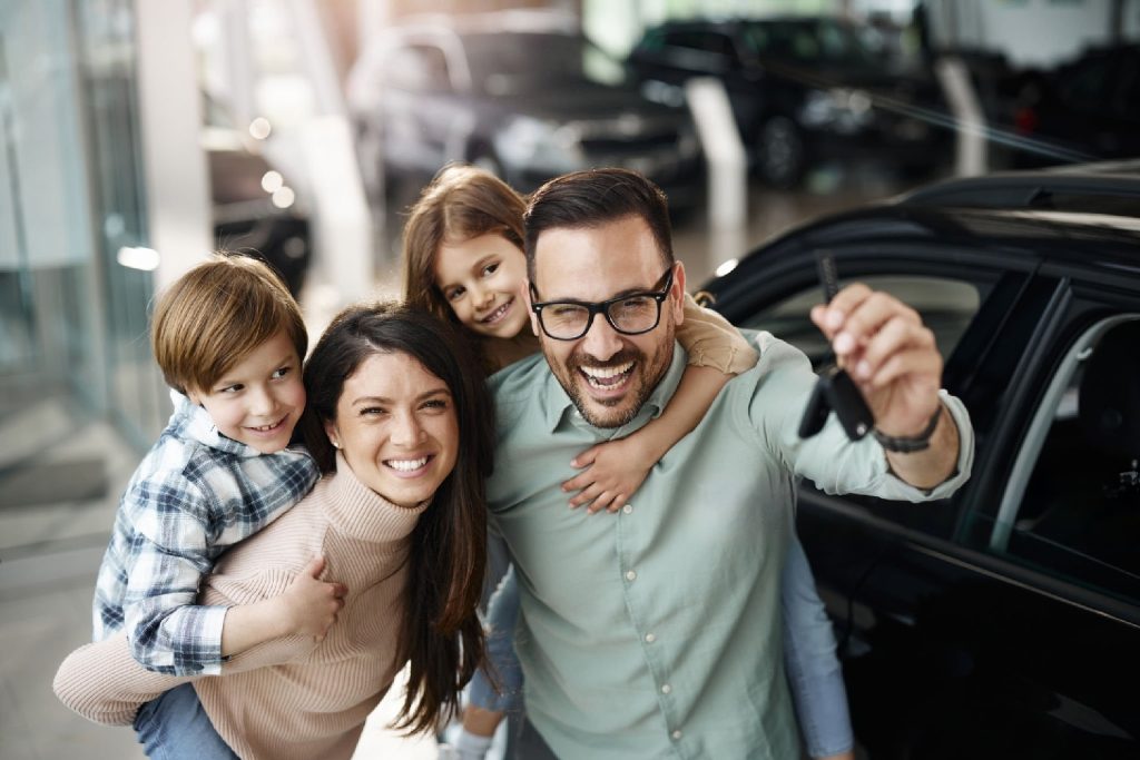 family being happy for purchase of a new car