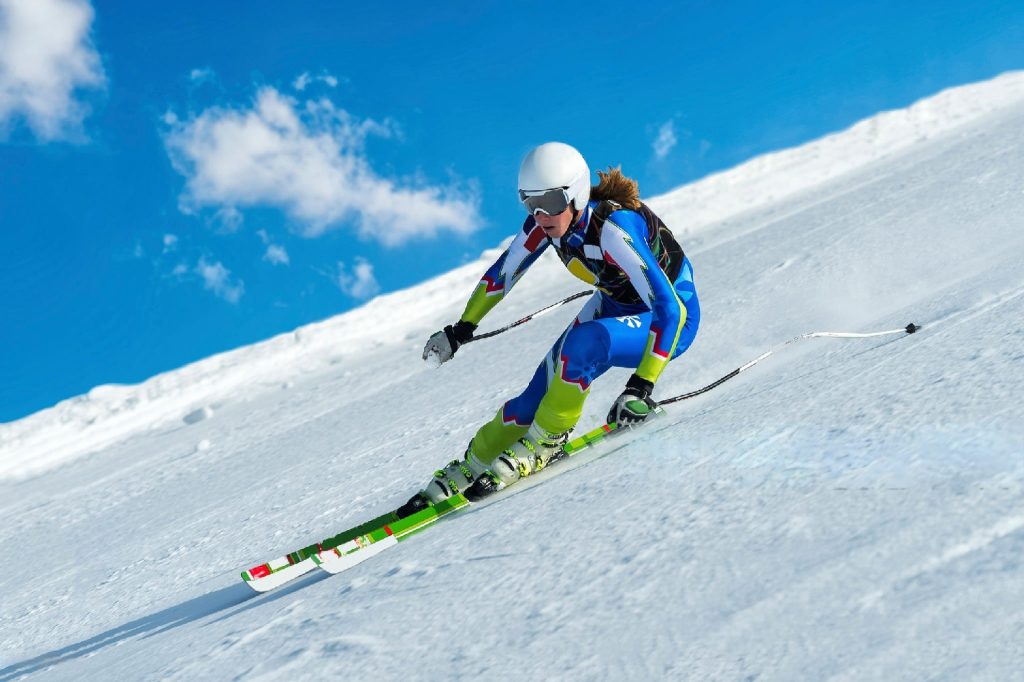 girl ski racing on snowy mountains