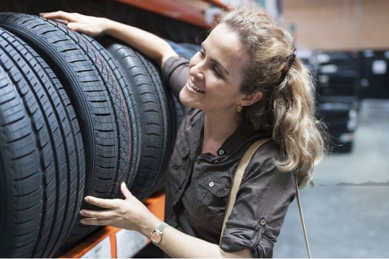 Woman Buying Tire