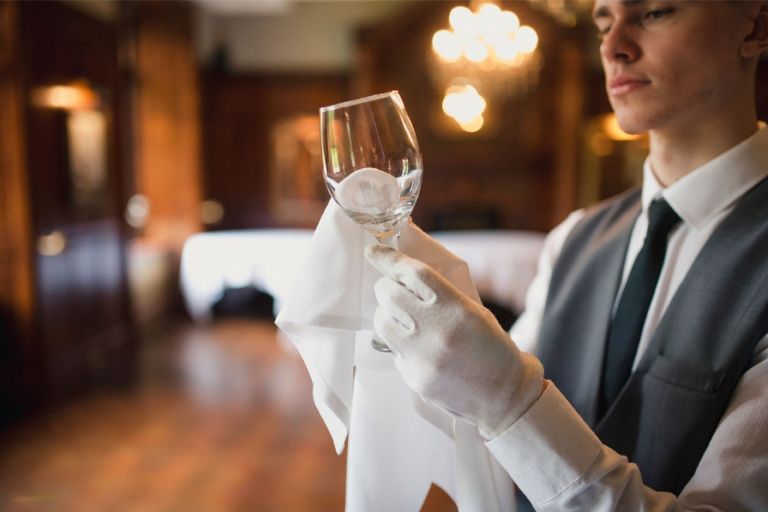 cleaning wine glass with microfiber cloth